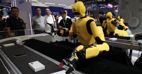 DexForce humanoid robots demonstrate working on a smartphone assembly and inspection production line at the World Robot Conference, Beijing, China, Aug. 19, 2026. (REUTERS Photo)