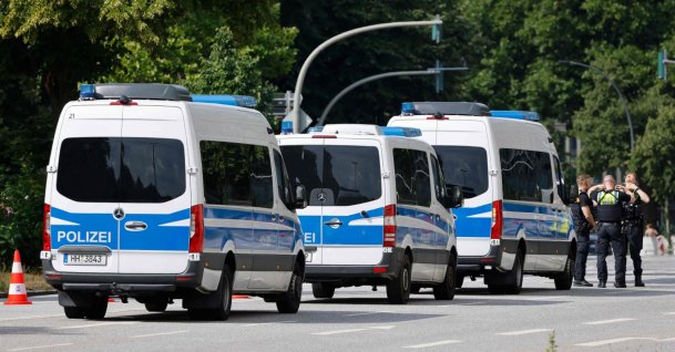 Police officers and vehicles are seen prior to the start of the Christopher Street Day (CSD) demonstration in Hamburg, northern Germany, Aug. 1, 2026. (AFP Photo)