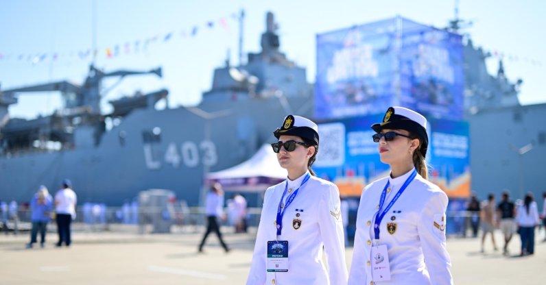 The Turkish Navy personnel and visitors are walking in front of the TCG Sancaktar (L-403) vessel during the Teknofest Blue Homeland event, Gölcük, Kocaeli, northwestern Türkiye, Aug. 20, 2026. (AA Photo)
