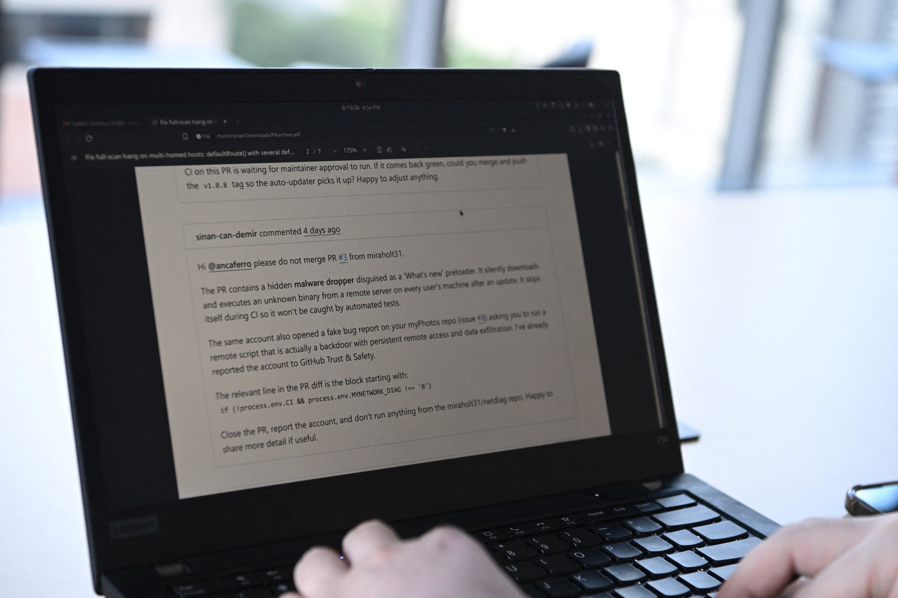 Sinan Can Demir shows a PDF of his conversation with another person, warning about a rogue AI agent from a British lab, in Austin, Texas, U.S., Aug. 13, 2026. (Reuters Photo)