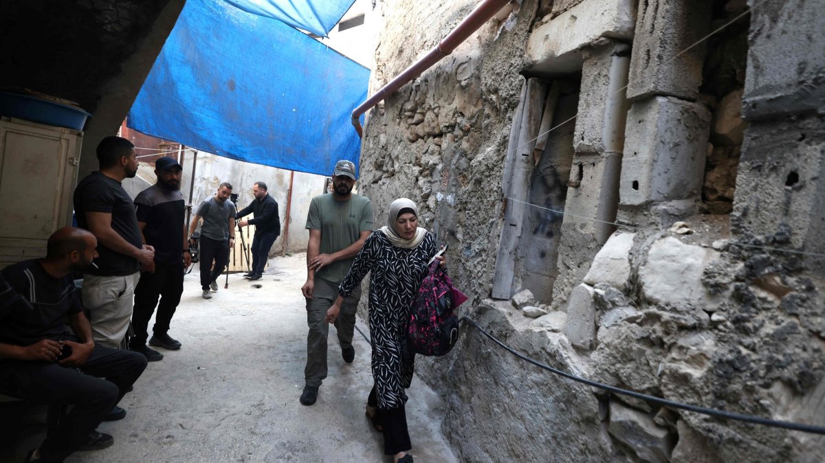 Suad, the wife of 58-year-old Fathi Zidan Hazem, who was killed by the Israeli military as they tried to arrest him, walks outside her home in the northern city of Jenin, West Bank, Palestine, Aug. 21, 2026. (AFP Photo)