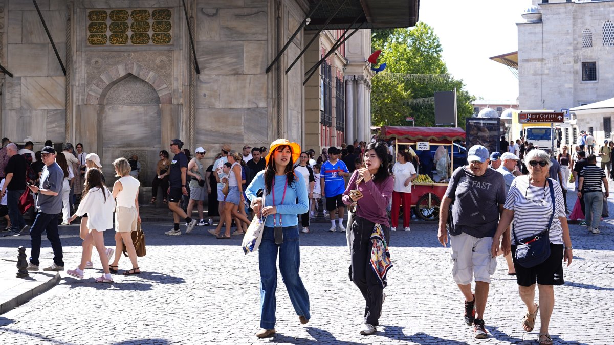 Tourists walk in the historic Eminönü district in Istanbul, Türkiye, July 29, 2026. (AA Photo)