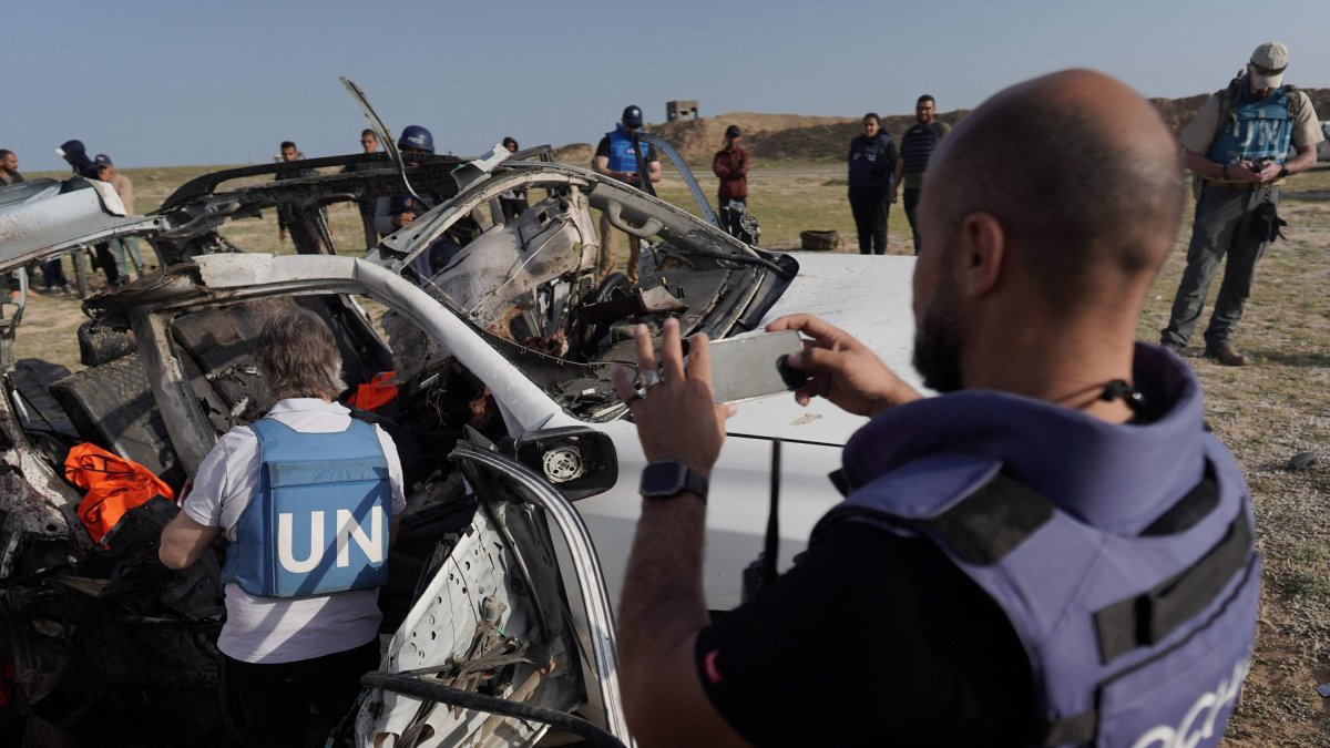 U.N. staff members inspect the remains of a car used by U.S.-based aid group World Central Kitchen that was hit by an Israeli strike the previous day, Deir al-Balah, Gaza Strip, Palestine, April 2, 2024. (AFP File Photo)