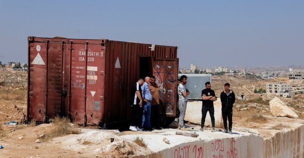 Palestinians inspect the damage after militant Israeli settlers set fire to stone quarry machinery, according to residents, near Hebron, West Bank, Palestine, Aug. 21, 2026. (Reuters Photo)