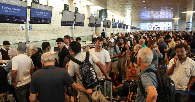 Passengers wait with their luggage at a check-in area amid disruptions caused by a surprise staff strike at Ben Gurion Airport in Lod, near Tel Aviv, Aug. 20, 2026. (AFP File Photo)