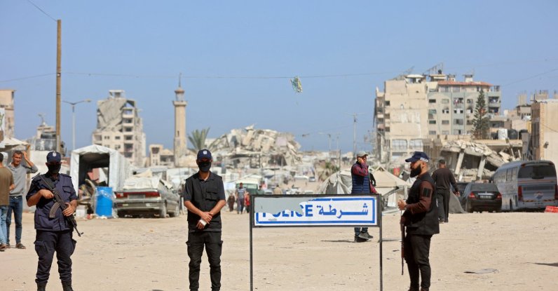 Palestinian group Hamas police officers stand guard as people attend the opening of the Fatah party's eighth general conference at Al-Azhar University in Gaza City, May 14, 2026. (AFP File Photo)