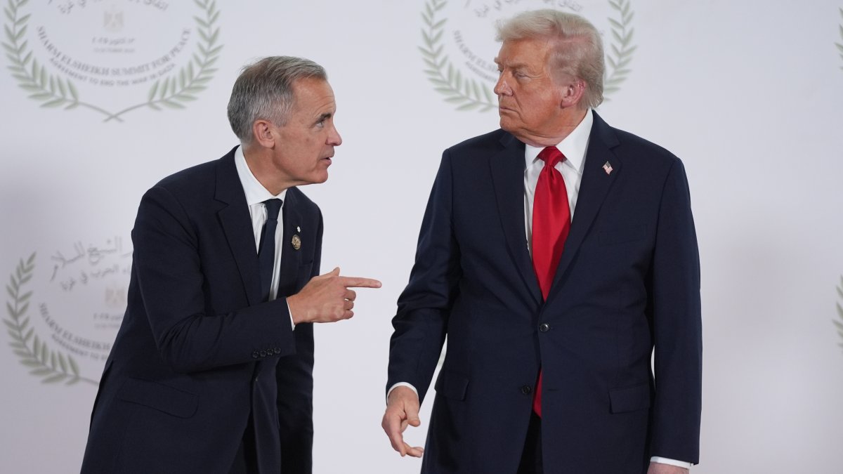 President Donald Trump (R) greets Canada's Prime Minister Mark Carney during a summit to support ending the more than two-year Israel-Hamas war in Gaza after a breakthrough cease-fire deal, Sharm El Sheikh, Egypt, Oct. 13, 2025. (AP Photo)