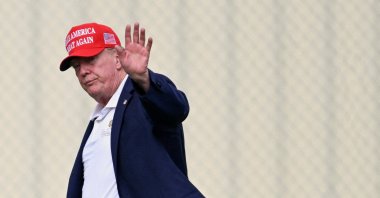 U.S. President Donald Trump waves as he walks from Marine One to a vehicle at the Ellipse near the White House, Washington, U.S., Aug. 16, 2026. (Reuters Photo)