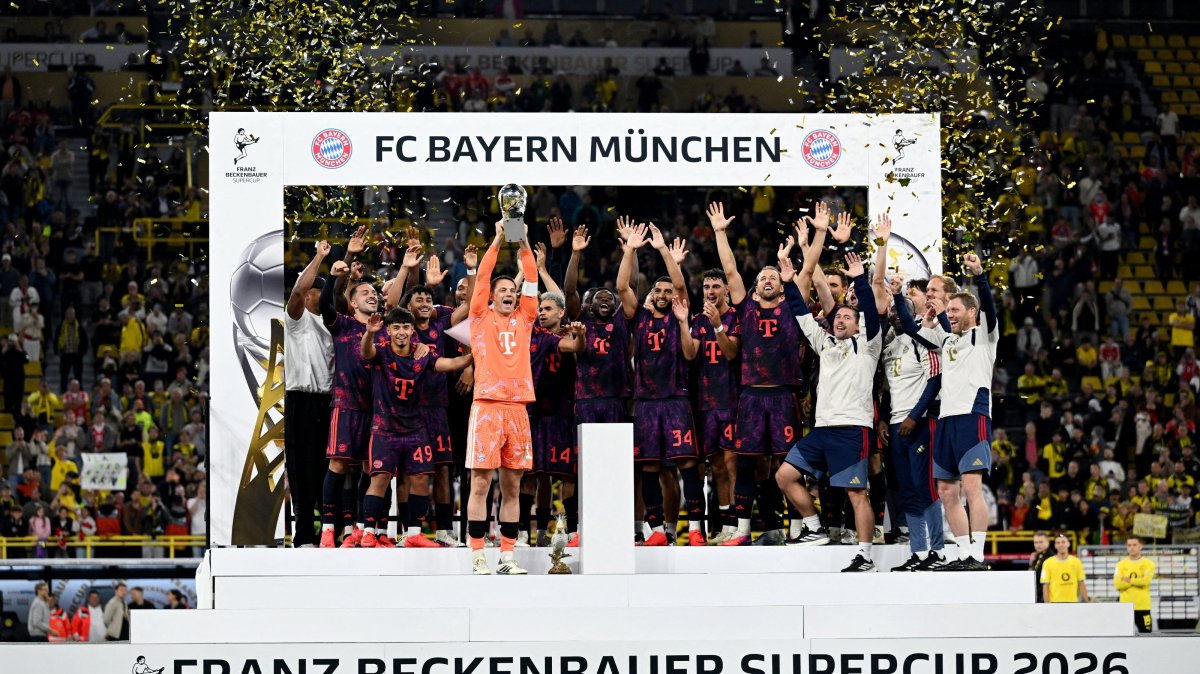 Bayern Munich players celebrate with the DFL Supercup after beating Borussia Dortmund at Signal Iduna Park, Dortmund, Germany, Aug. 22, 2026. (Reuters Photo)