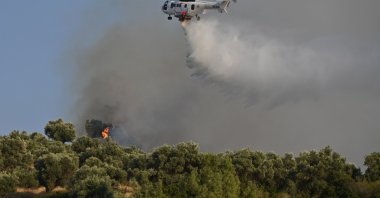 Aerial operations continue to help control a wildfire, Turgutlu, Manisa, Türkiye, Aug. 19, 2026. (AA Photo)