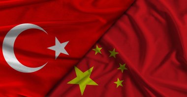 The flags of Türkiye (L) and China (R) are pictured side by side. (Shutterstock Photo)