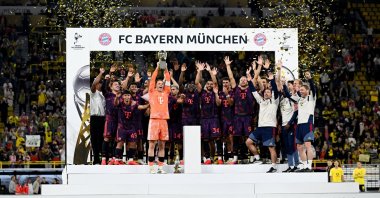 Bayern Munich players celebrate with the DFL Supercup after beating Borussia Dortmund at Signal Iduna Park, Dortmund, Germany, Aug. 22, 2026. (Reuters Photo)