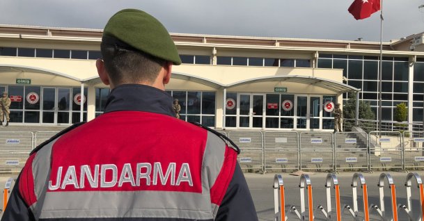 A gendarmerie officer stands outside the prison-courthouse complex where the trial's next hearing will be held, Istanbul, Türkiye, April 30, 2018. (AP Photo)