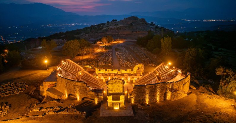 An aerial view of the restored ancient theater at Tlos illuminated by a solar energy system, Muğla, Türkiye, Aug. 22, 2026. (AA Photo)