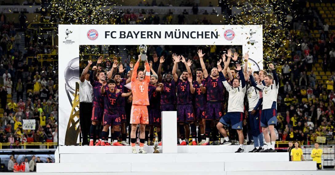 Bayern Munich players celebrate with the DFL Supercup after beating Borussia Dortmund at Signal Iduna Park, Dortmund, Germany, Aug. 22, 2026. (Reuters Photo)