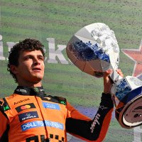 McLaren's British driver Lando Norris celebrates with the trophy on the podium after the Formula 1 Dutch GP at The Circuit Zandvoort, western Netherlands, Aug. 23, 2026. (AFP Photo)