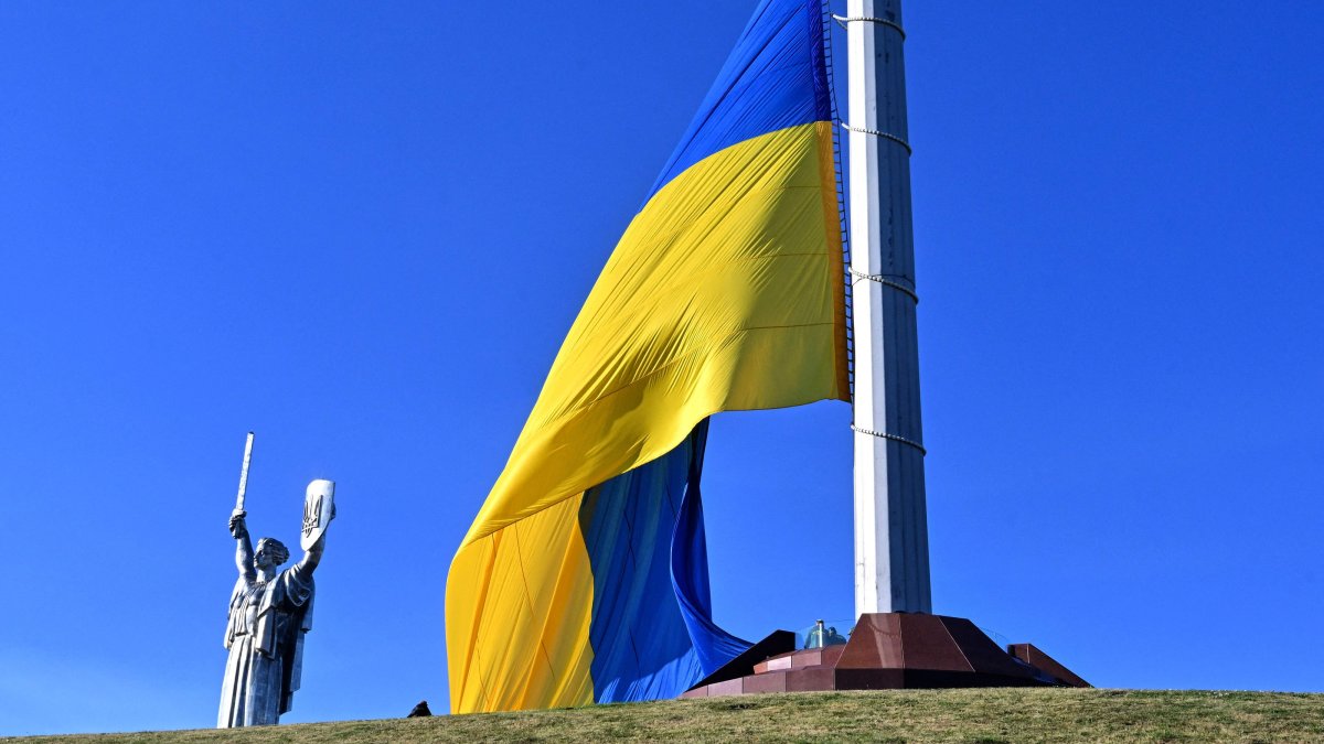 Ukraine's biggest national flag is seen in front of Motherland Monument during a ceremony marking the National Flag Day of Ukraine in Kyiv, Ukraine, Aug. 23, 2026. (AFP Photo)