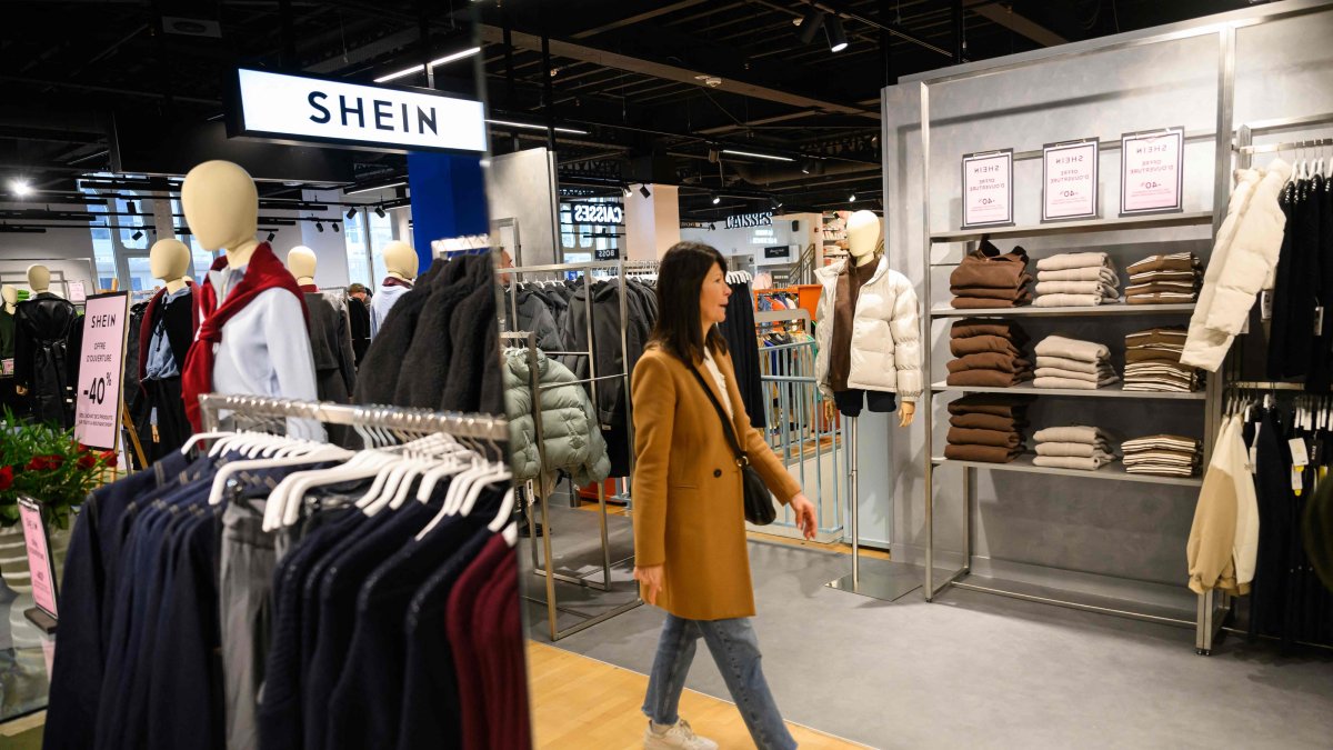 A customer visits the new Shein fast-fashion retail at its opening day in the BHV department store, Angers, western France, Feb. 25, 2026. (AFP Photo)