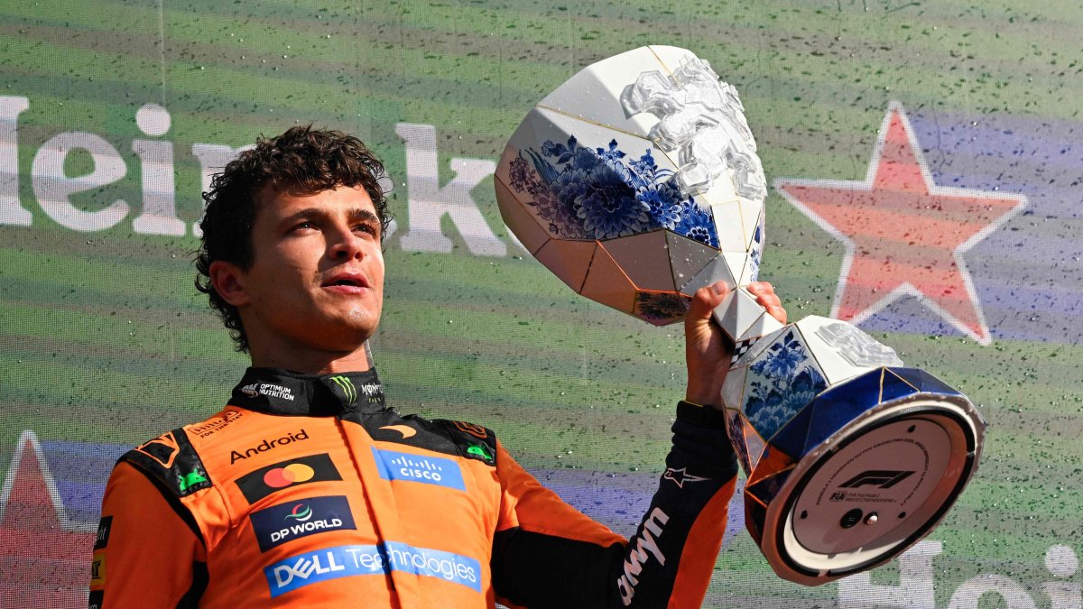 McLaren's British driver Lando Norris celebrates with the trophy on the podium after the Formula 1 Dutch GP at The Circuit Zandvoort, western Netherlands, Aug. 23, 2026. (AFP Photo)