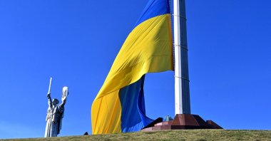 Ukraine's biggest national flag is seen in front of Motherland Monument during a ceremony marking the National Flag Day of Ukraine in Kyiv, Ukraine, Aug. 23, 2026. (AFP Photo)