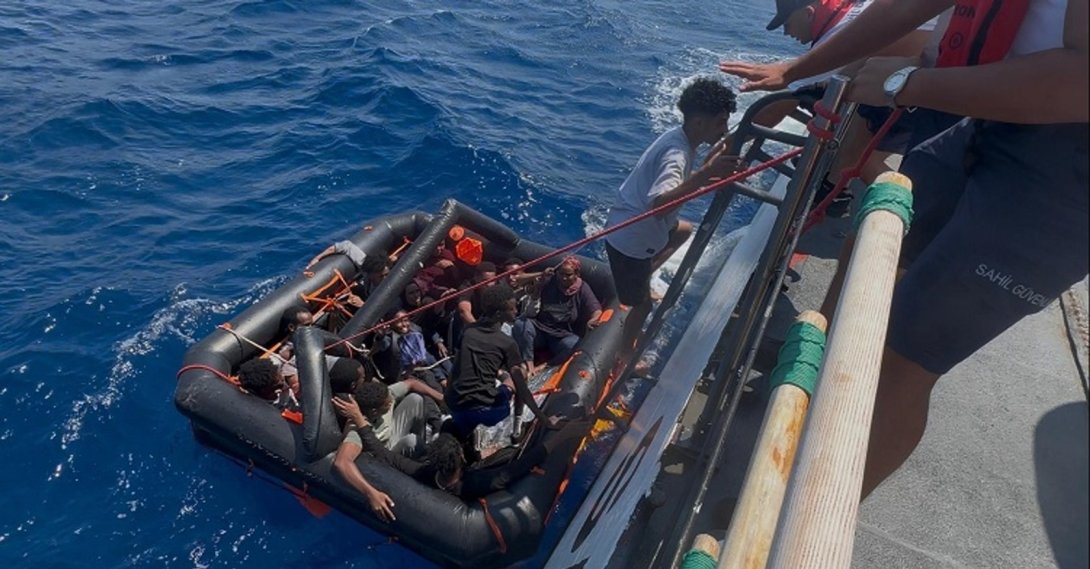 Irregular migrants are rescued from a life raft after being pushed back into Turkish territorial waters by Greek authorities off the coast of Muğla, Türkiye, Aug. 23, 2026. (AA Photo)