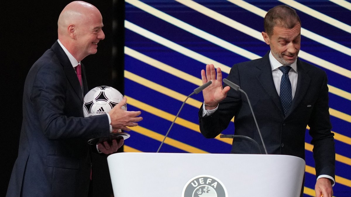 FIFA President Gianni Infantino (L) speaks with UEFA President Aleksander Ceferin after addressing the 50th UEFA Ordinary Congress, Brussels, Belgium, Feb. 12, 2026. (AFP Photo)