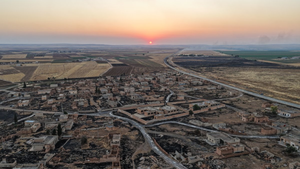 Ahmet Abbas, a 75-year-old resident of Raqqa, returned years later to the village of Salib near the Syria-Türkiye border, which he had been forced to leave nearly 12 years ago due to pressure from YPG terrorists, Raqqa, Syria, July 27, 2026. (AA Photo)