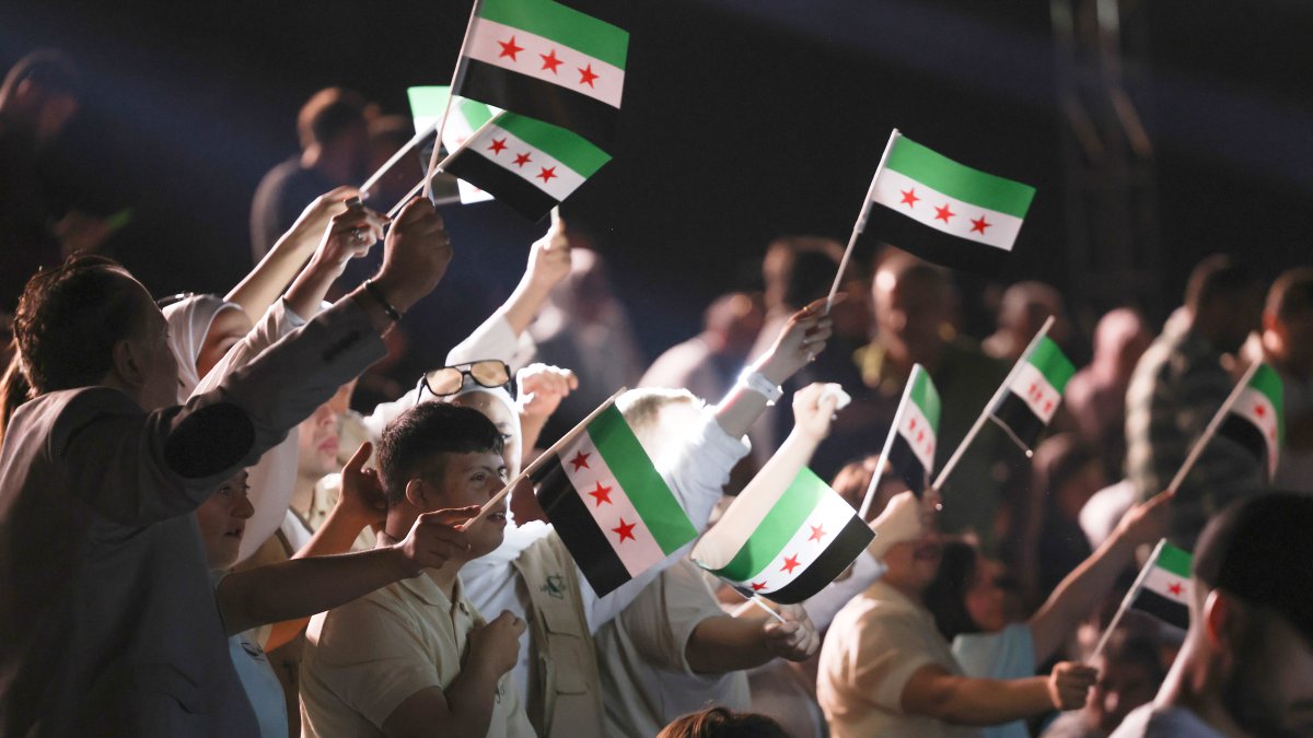 People celebrate the reopening of the historic Aleppo Citadel after restoration works that cover war-damaged sections, Aleppo, Syria, Sept. 27, 2025. (Getty Images Photo)