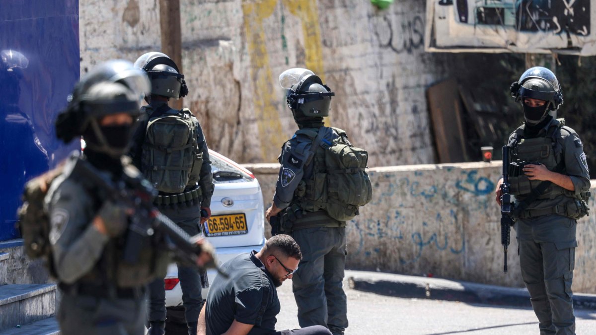 Israeli forces detain a Palestinian man during a raid on the UNRWA Vocational Training Centre, located between the Kafr Aqab neighbourhood and the Qalandia refugee camp, south of the West Bank city of Ramallah, Aug. 25, 2026. (AFP Photo)