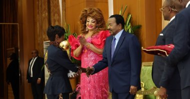 Cameroon's President Paul Biya (R) shake hands with a Cameroonian female football team player during a reception at the Unity Palace, Yaounde, Cameroon, Aug. 22, 2026. (AP Photo)