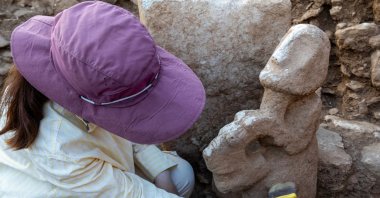 A composite sculpture depicting a human figure seated on the back of a leopard, dating back about 11,000 years, was unearthed during ongoing excavations at Karahantepe, Şanlıurfa, Türkiye, Aug. 25, 2026. (DHA Photo)