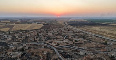 Ahmet Abbas, a 75-year-old resident of Raqqa, returned years later to the village of Salib near the Syria-Türkiye border, which he had been forced to leave nearly 12 years ago due to pressure from YPG terrorists, Raqqa, Syria, July 27, 2026. (AA Photo)