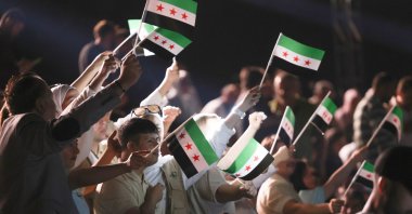 People celebrate the reopening of the historic Aleppo Citadel after restoration works that cover war-damaged sections, Aleppo, Syria, Sept. 27, 2025. (Getty Images Photo)
