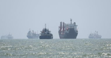 Vessels in the Strait of Hormuz are visible near the beach of Bandar Abbas, Iran, August 25, 2026. (Reuters Photo)