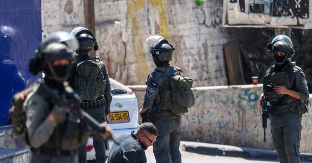 Israeli forces detain a Palestinian man during a raid on the UNRWA Vocational Training Centre, located between the Kafr Aqab neighbourhood and the Qalandia refugee camp, south of the West Bank city of Ramallah, Aug. 25, 2026. (AFP Photo)