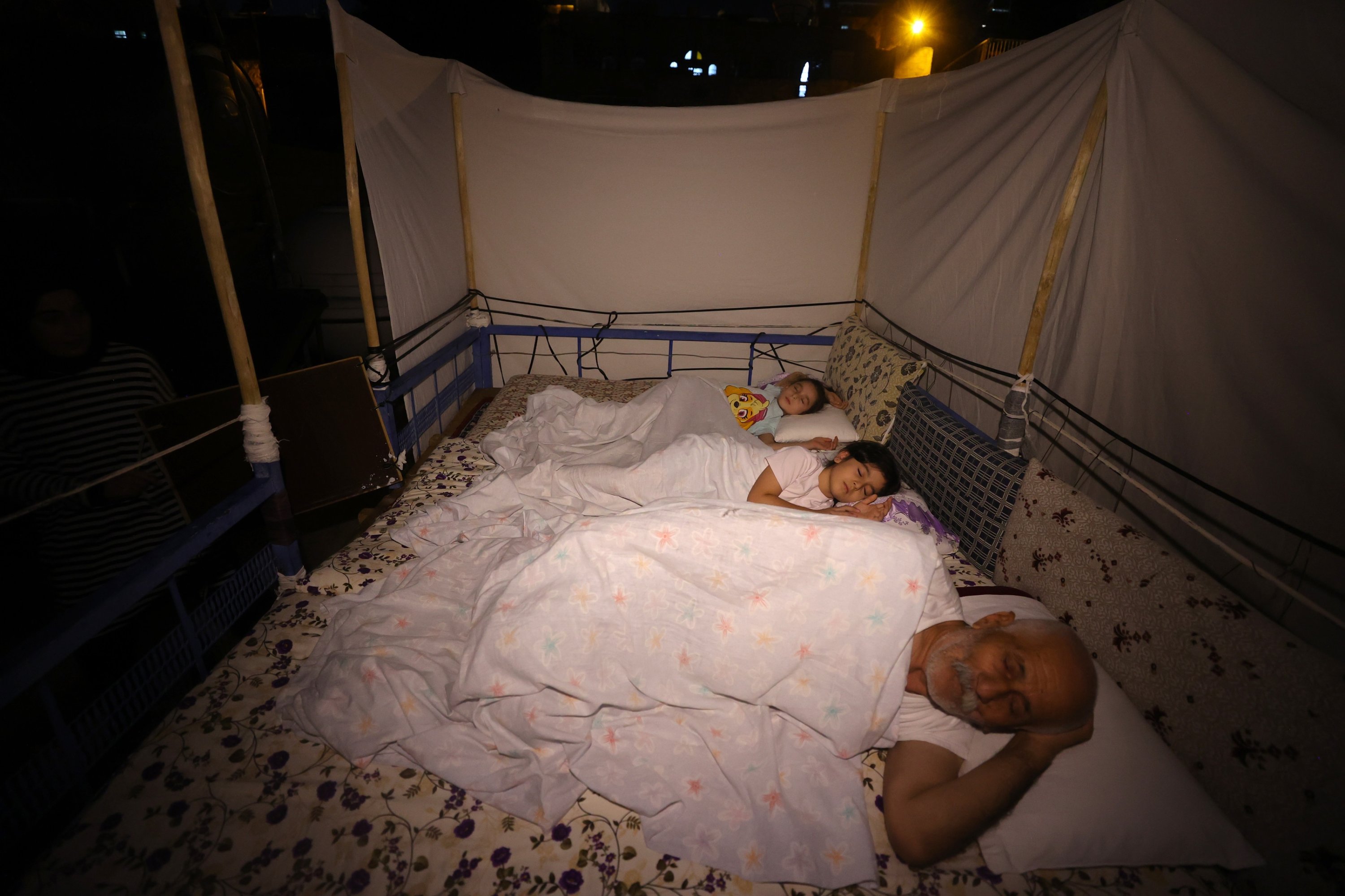 Residents sleep on traditional rooftop platforms, seeking relief from the city’s summer heat, Mardin, southeastern Türkiye, Aug. 4, 2026. (AA Photo)