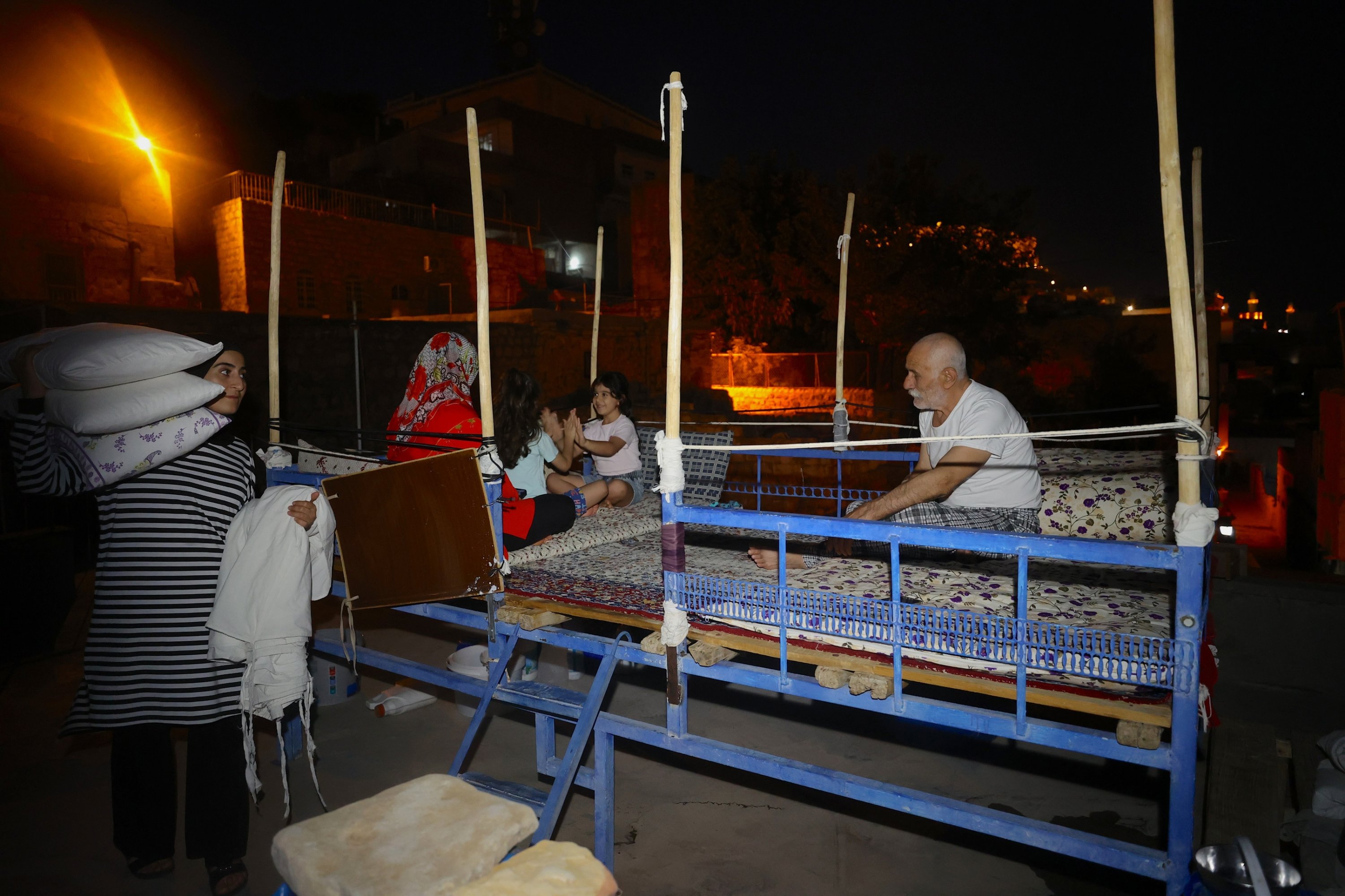 Residents prepare their rooftops for sleeping during Mardin’s hot summer nights, Mardin, southeastern Türkiye, Aug. 4, 2026. (AA Photo)