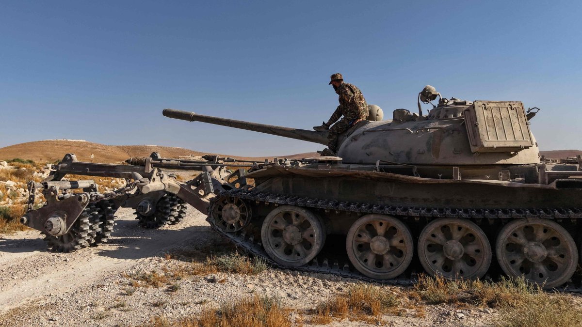 A Syrian army soldier sits on a mine-clearing tank of the Syrian Ministry of Defence's military engineering department during a demining operation, Qarah, Syria, Aug. 23, 2026. (AFP Photo)
