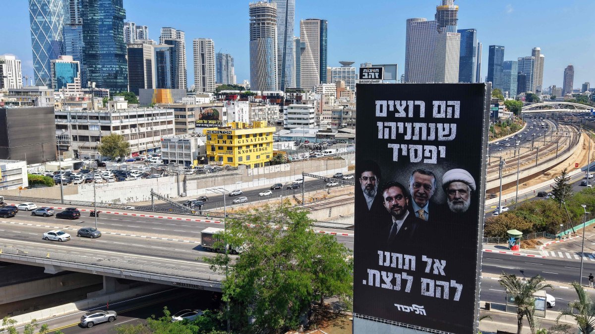 A billboard by the Likud Party of Israeli Prime Minister Benjamin Netanyahu depicting President Recep Tayyip Erdoğan (C-R) with other leaders, with Hebrew text reading "They want Netanyahu to lose, don't let them win," ahead of Israel's general election, is posted near a highway, Tel Aviv, Israel, Aug. 19, 2026. (AFP Photo)