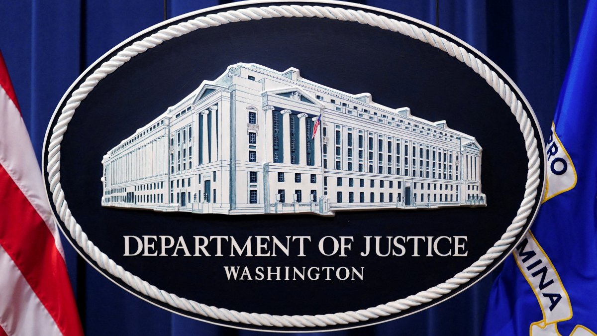 A U.S. Justice Department logo or seal showing Justice Department headquarters, known as "Main Justice," is seen behind the podium in the Department's headquarters briefing room before a news conference with the Attorney General in Washington, Jan. 24, 2023. (Reuters File Photo)