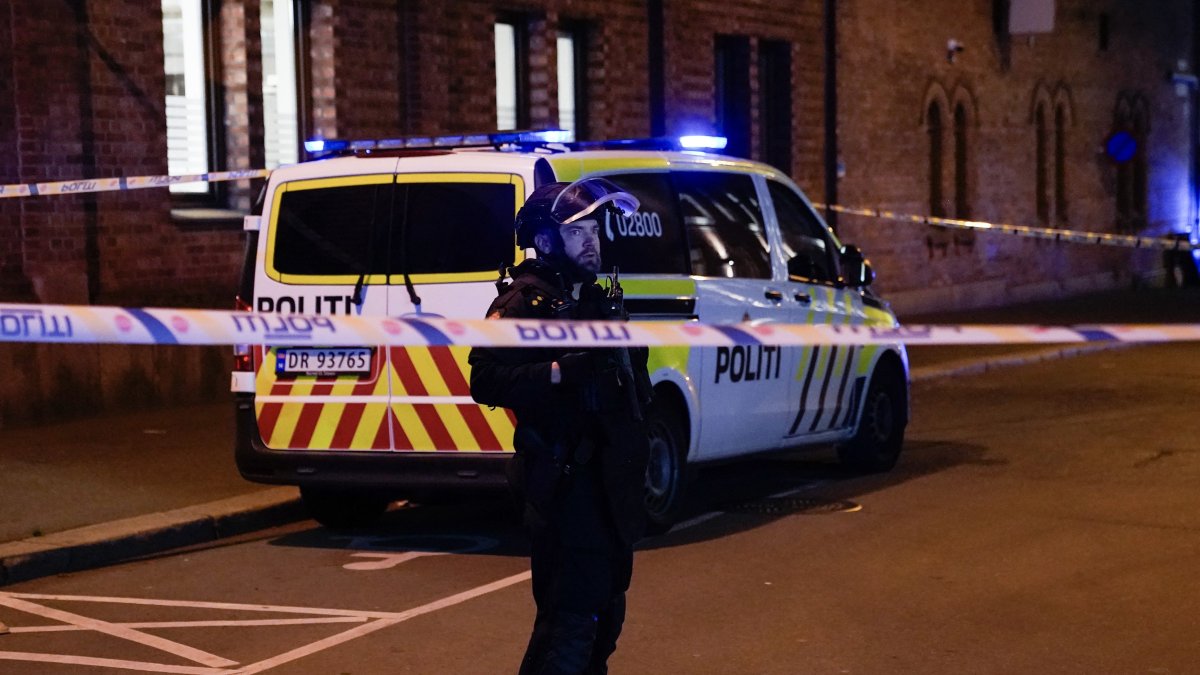 A police officer is seen behind a band in Pilestredet, just off Parkveien in Oslo, Norway, Sept. 23, 2025. (AFP File Photo)
