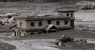 Mud covers a property following a flash flood at Trishuli in Nuwakot district, Nepal, Aug. 26, 2026. (Reuters Photo)
