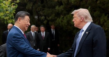 U.S. President Donald Trump shakes hands with Chinese President Xi Jinping as they leave after a visit to the Zhongnanhai Garden, Beijing, China, May 15, 2026. (Reuters Photo)
