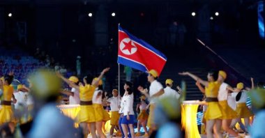 Athletes from North Korea hold their national flag at the Asian Games Opening Ceremony at Hangzhou Olympic Sports Center Stadium, Hangzhou, China, Sept. 23, 2023. (Reuters Photo)