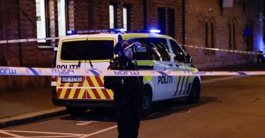 A police officer is seen behind a band in Pilestredet, just off Parkveien in Oslo, Norway, Sept. 23, 2025. (AFP File Photo)