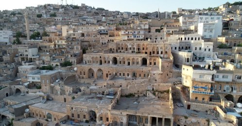 An aerial view of traditional stone houses and rooftop platforms used by residents to escape the summer heat, Mardin, southeastern Türkiye, Aug. 4, 2026. (AA Photo)