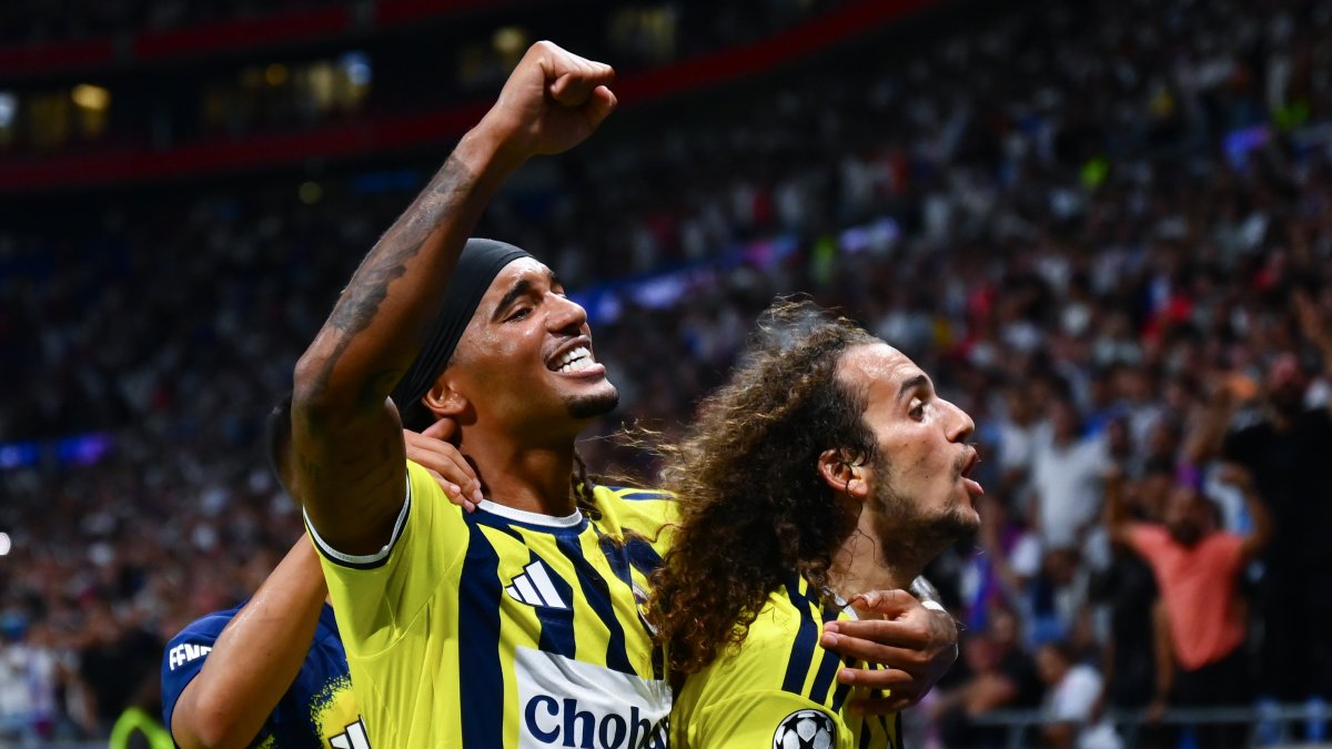 Fenerbahçe's Matteo Guendouzi (R) and Archie Brown celebrate after beating Olympique Lyon in the UEFA Champions League playoffs, Lyon, France, Aug. 27, 2028. (AA Photo)