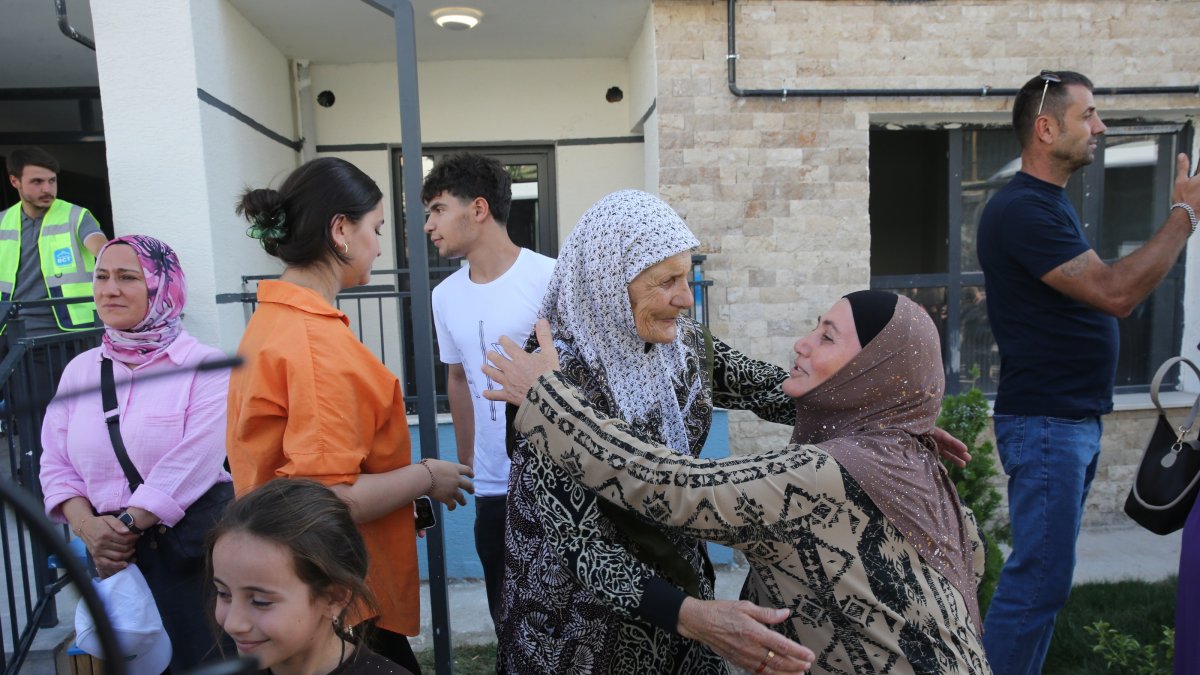 Ahıska Turks share their happiness as they move into permanent homes built for them, Ahlat, Bitlis, Türkiye, Aug. 22, 2026. (AA Photo)