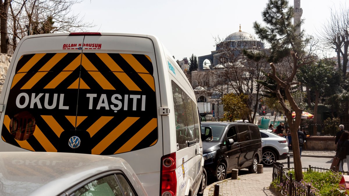 A white school bus with a “School Bus” sign, Istanbul, Türkiye, March 24, 2022. (Shutterstcok Photo) 