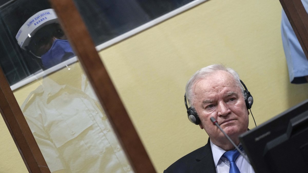 Ex-Bosnian Serb military chief Ratko Mladic sits in the defendant box during the hearing of the final verdict on appeal against his genocide conviction, at the International Residual Mechanism for Criminal Tribunals (IRMCT) in The Hague, June 8, 2021. (AFP File Photo)
